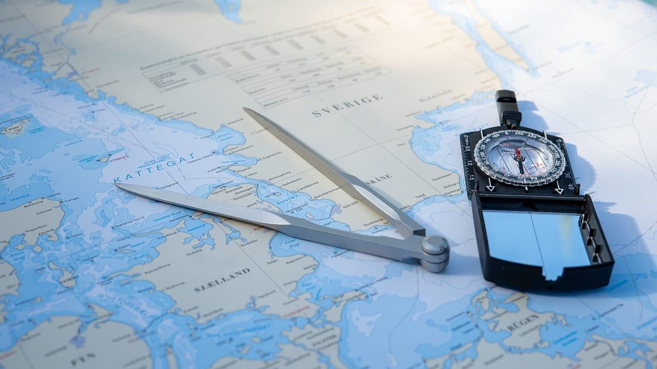 a compass on world map